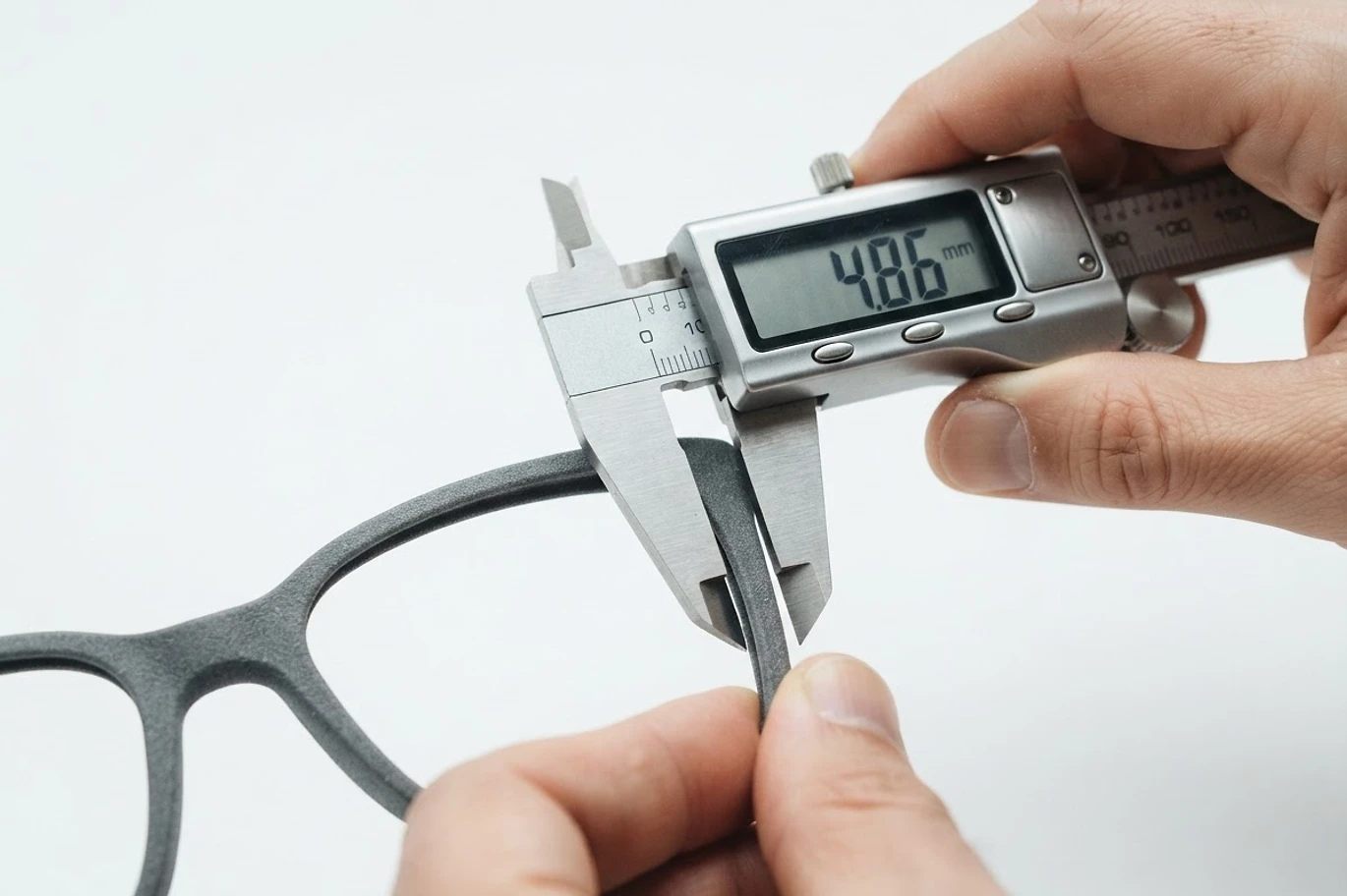 Eyewear frame being measured for precise fit and quality